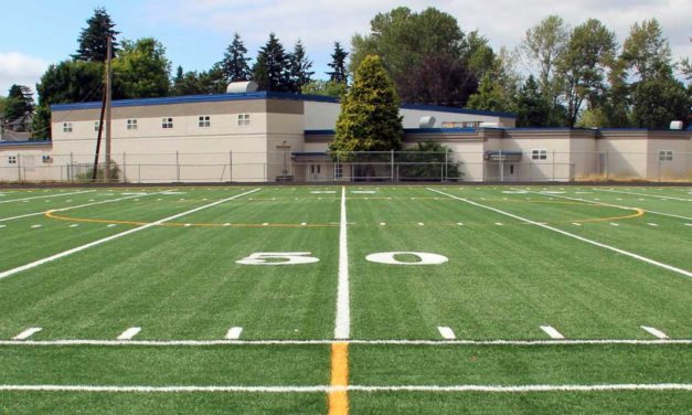 PHOTOS: Crews install new synthetic turf at Evergreen High School field